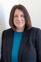 perfect profile photo of professional woman in teal top and black blazer