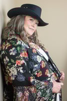 confident woman over 50 in her favorite outfit and hat