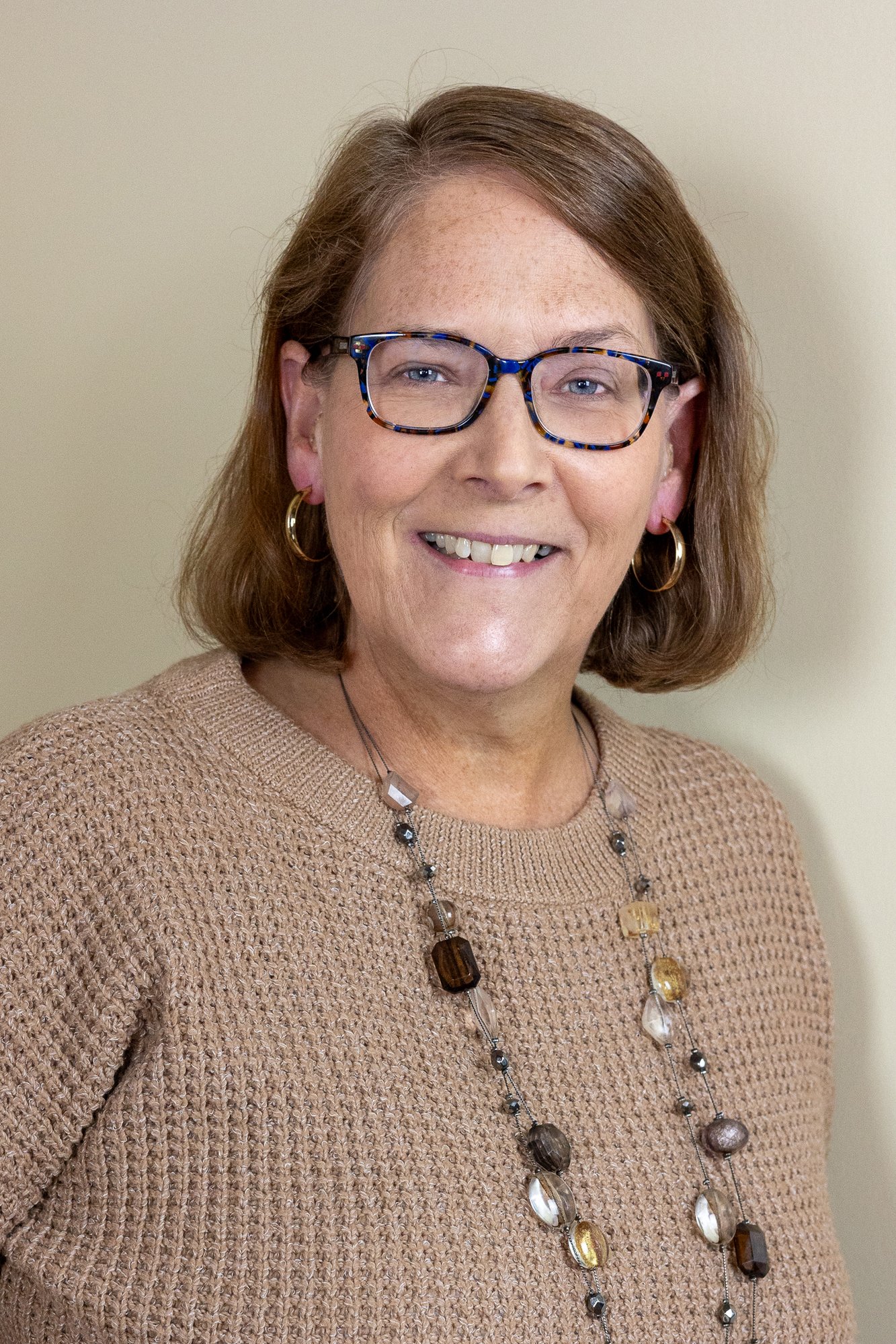 business woman in beige casual sweater business woman in beige casual sweater