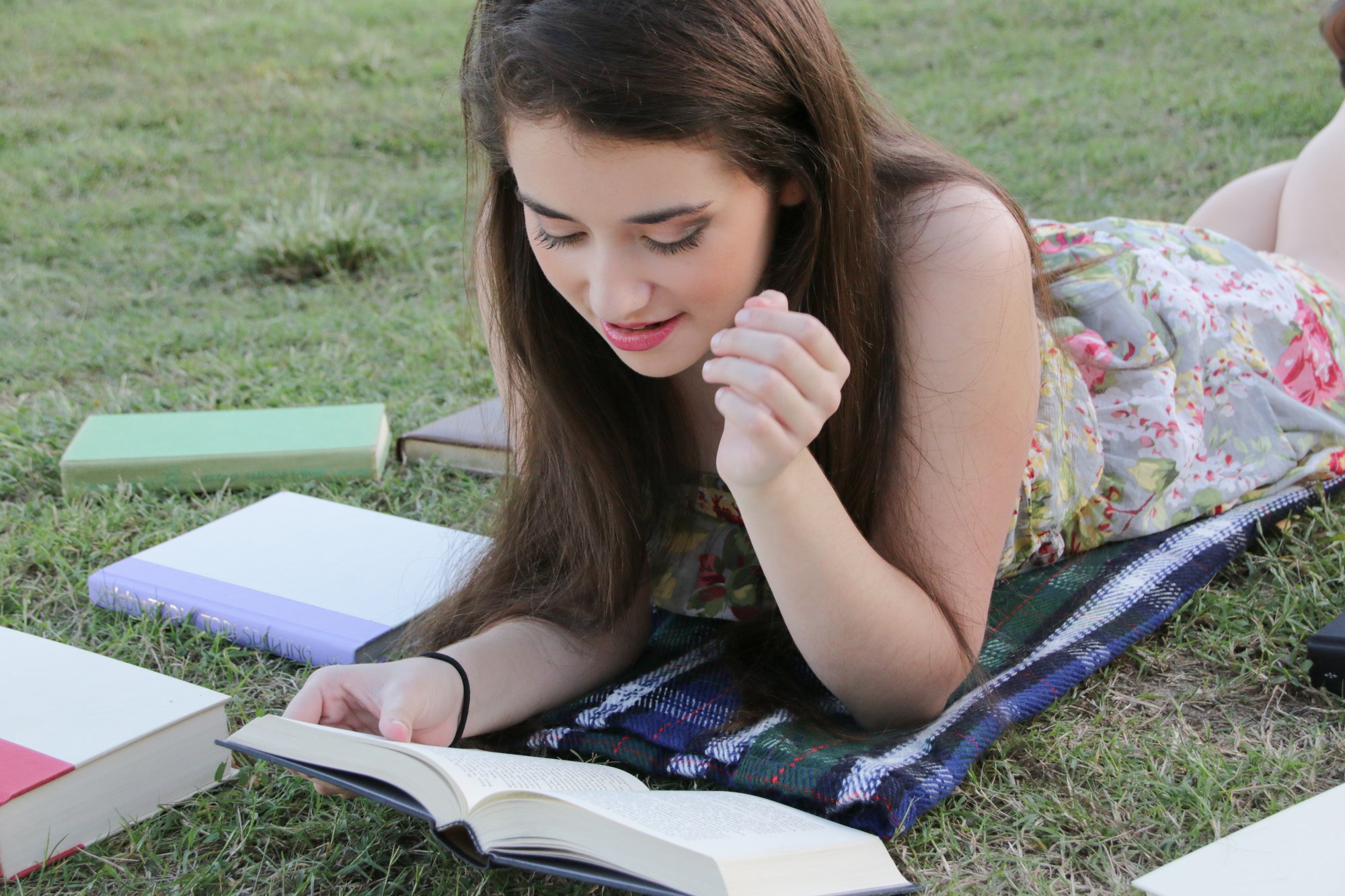 senior girl reading outside