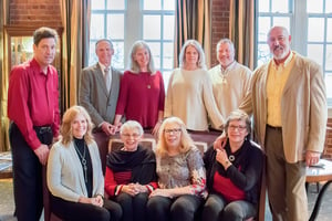 formal family photo with coordinating casual outfits for winter