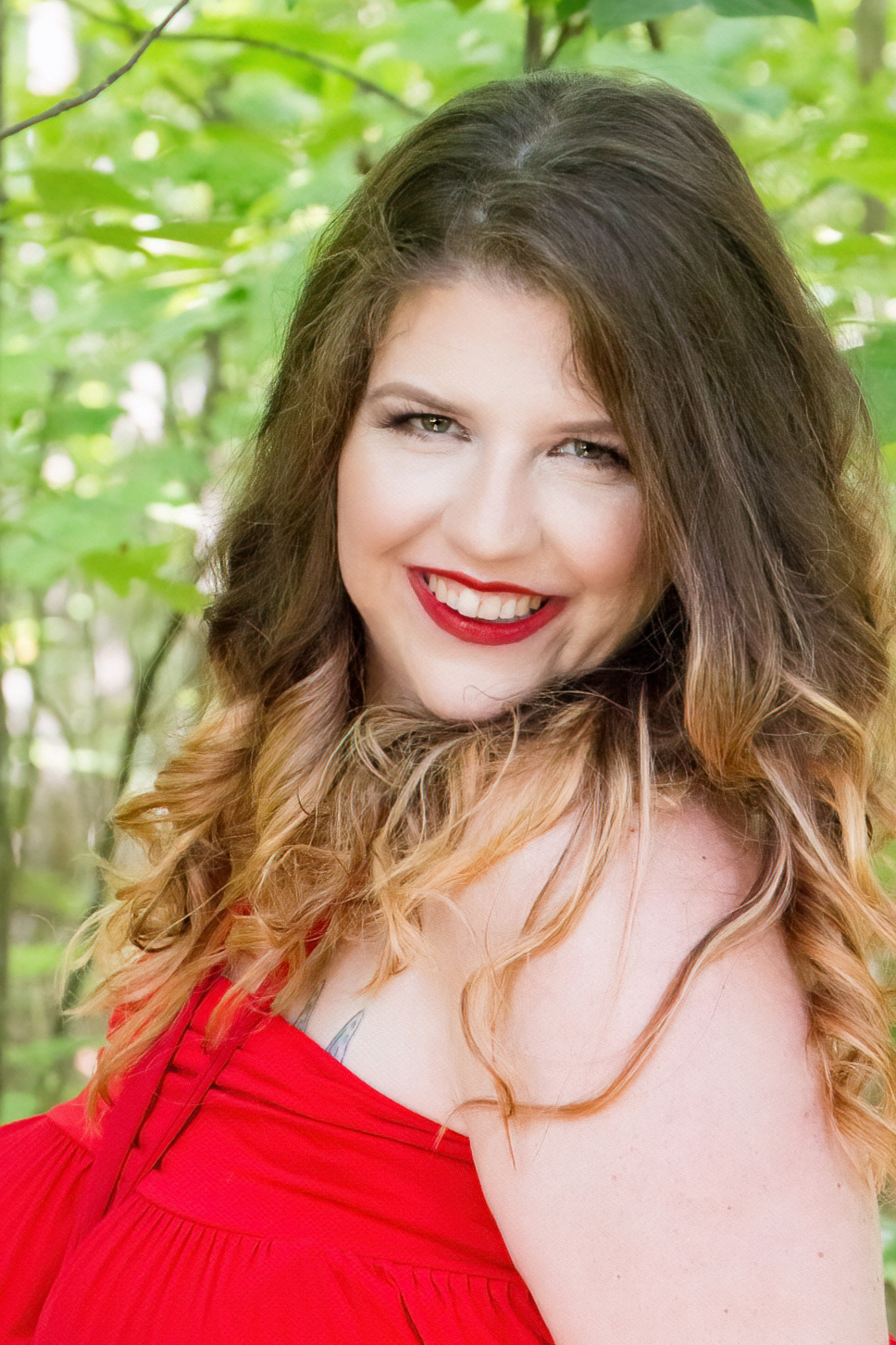 red dress in the green trees